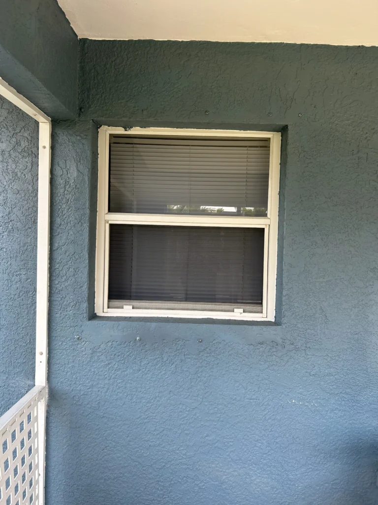 The old window showcases signs of aging and may require window replacement | Sun Control Aluminum & Remodeling